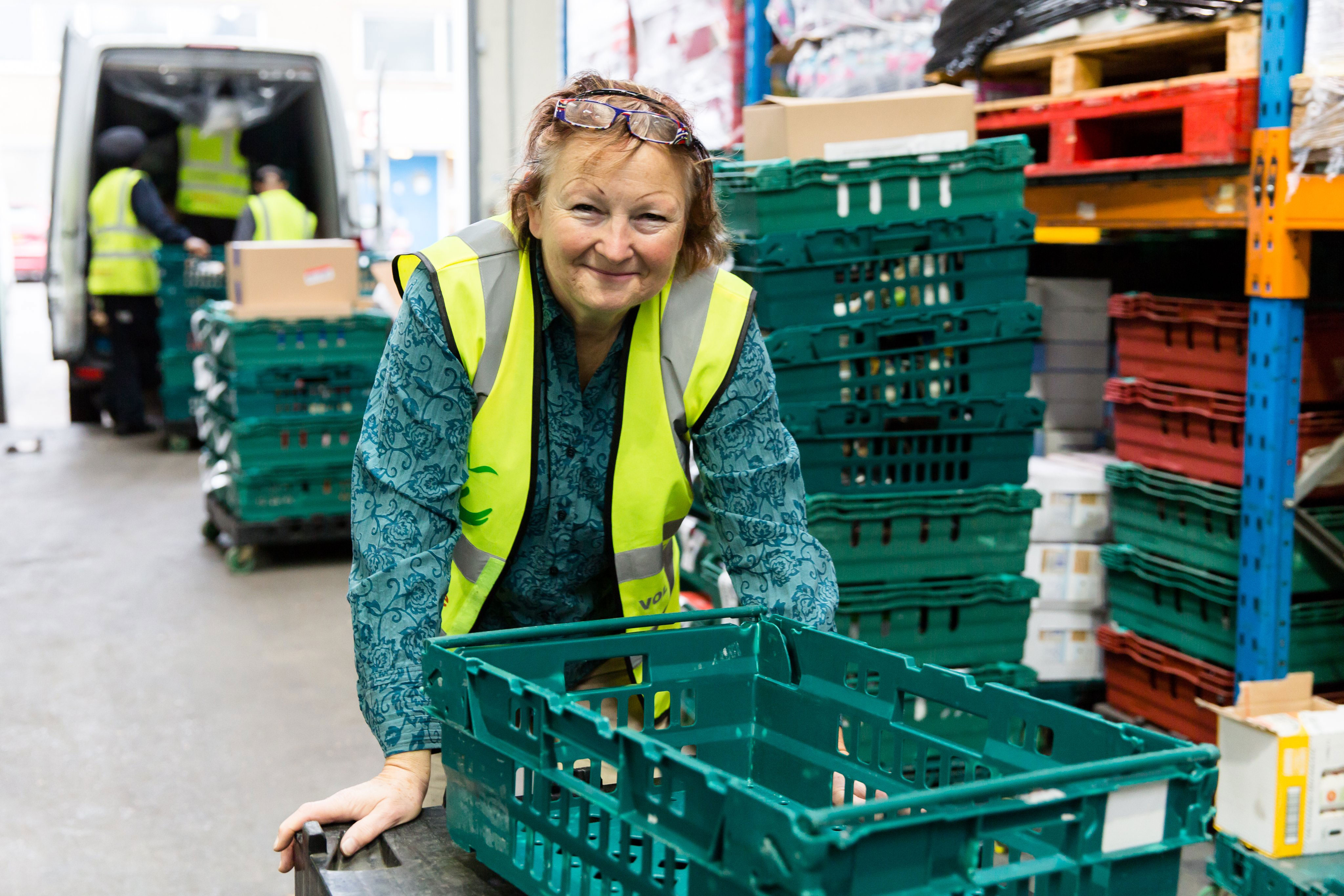 A volunteer prepares a delivery at the FareShare Warehouse