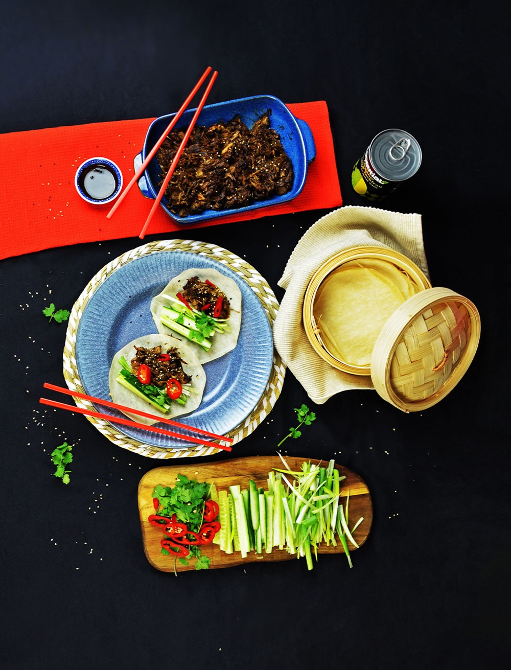 hoisin jackfruit pancakes on a table with serving ingredients