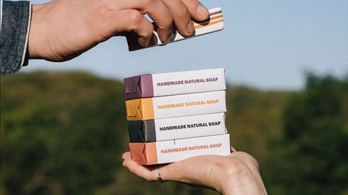 A tower of plastic-free wrapped soaps from Wylder Naturals
